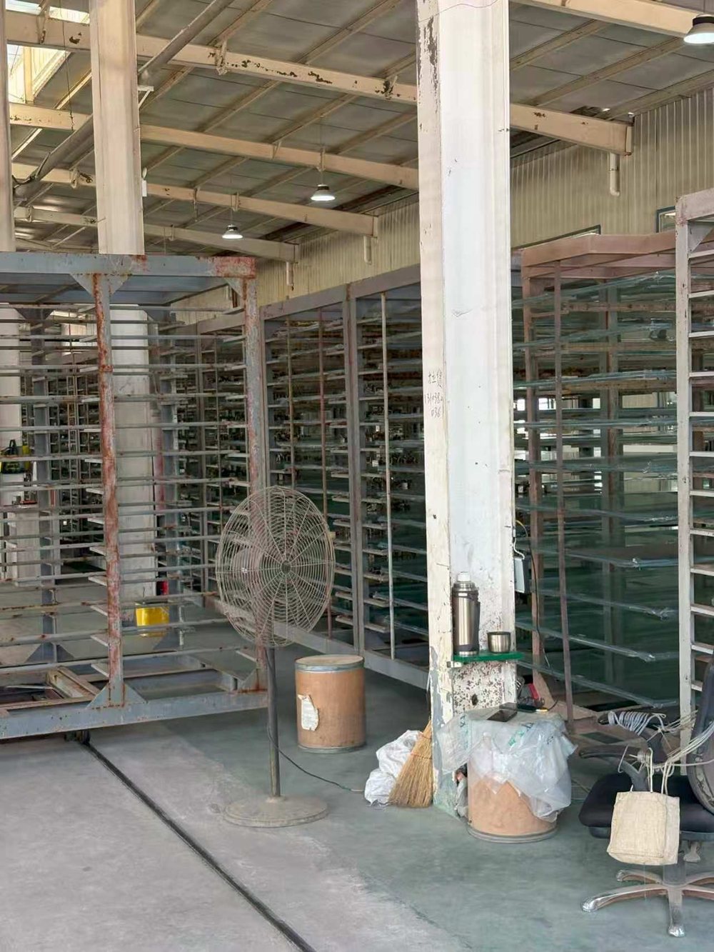 Acrylic sheets curing in vertical storage racks