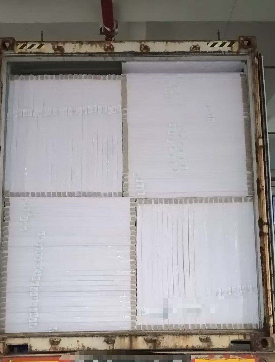 Container loaded with white PVC foam board sheets for export